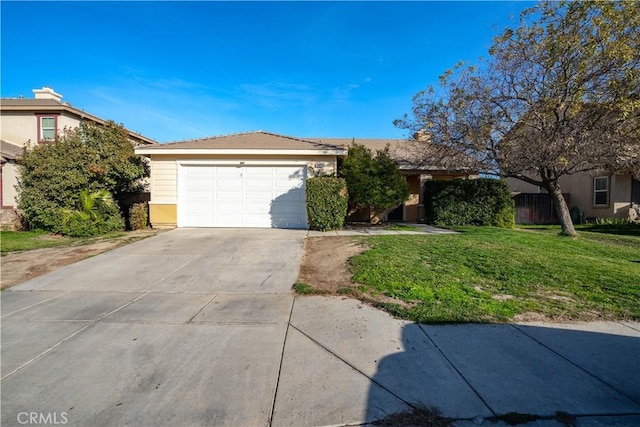 view of front facade with a garage and a front yard