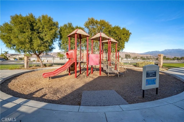 view of play area featuring a mountain view