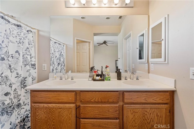 bathroom featuring ceiling fan, vanity, and a shower with shower curtain