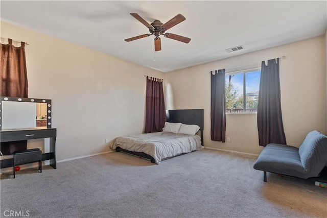 carpeted bedroom with ceiling fan