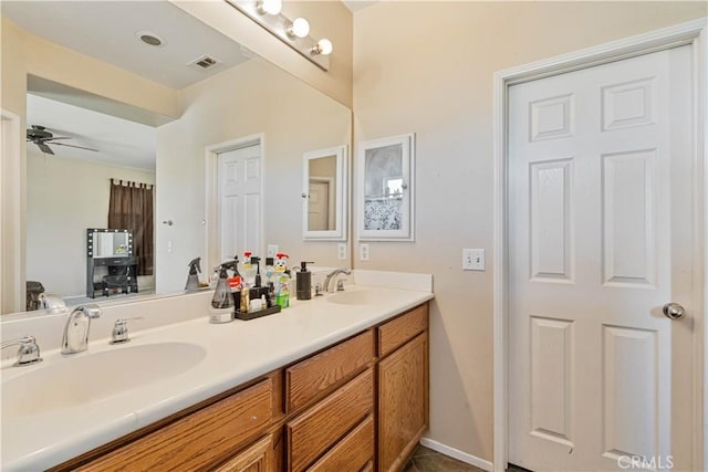 bathroom with ceiling fan, tile patterned floors, and vanity