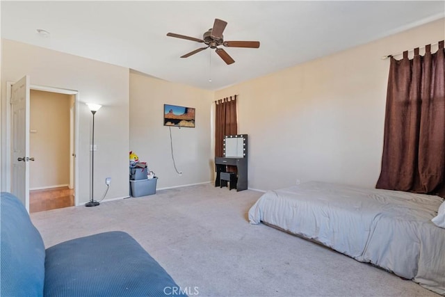 bedroom featuring ceiling fan and light colored carpet