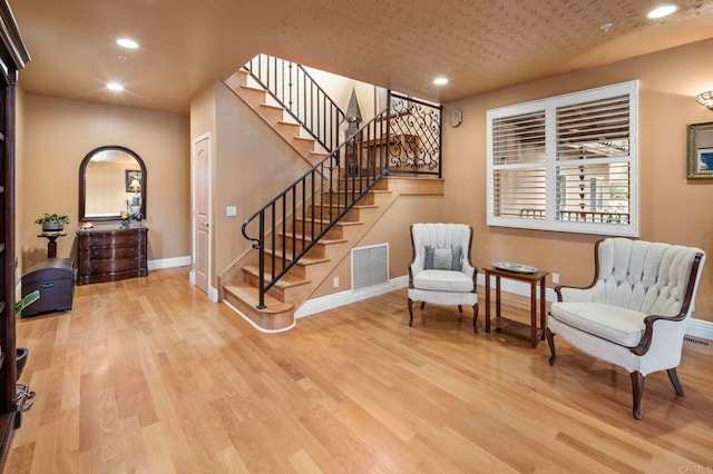 sitting room featuring light hardwood / wood-style floors