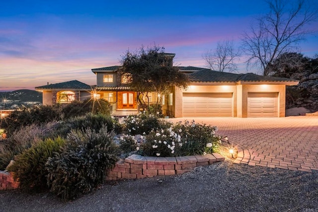 prairie-style home featuring a garage