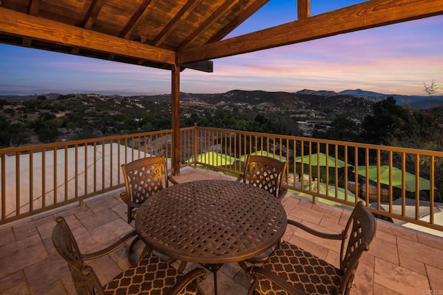 deck at dusk with a mountain view