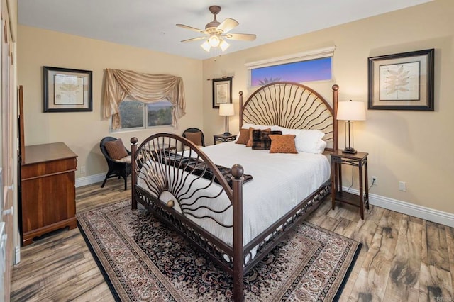 bedroom featuring ceiling fan and light wood-type flooring