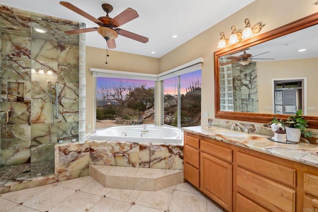 bathroom with separate shower and tub, vanity, and ceiling fan