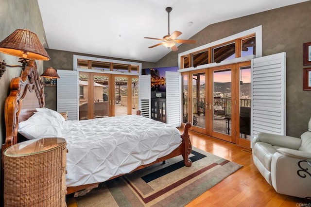 bedroom featuring ceiling fan, light hardwood / wood-style floors, access to outside, and french doors