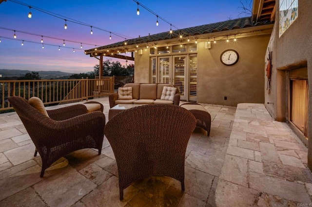 patio terrace at dusk with an outdoor hangout area