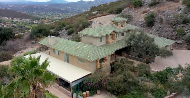 birds eye view of property featuring a mountain view