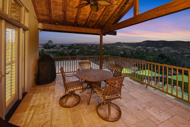 view of balcony at dusk