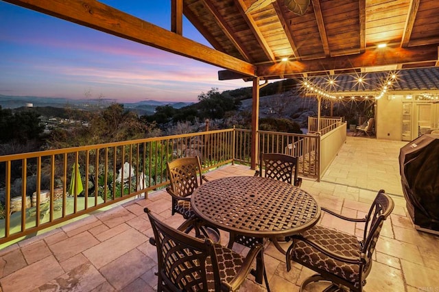 view of patio terrace at dusk