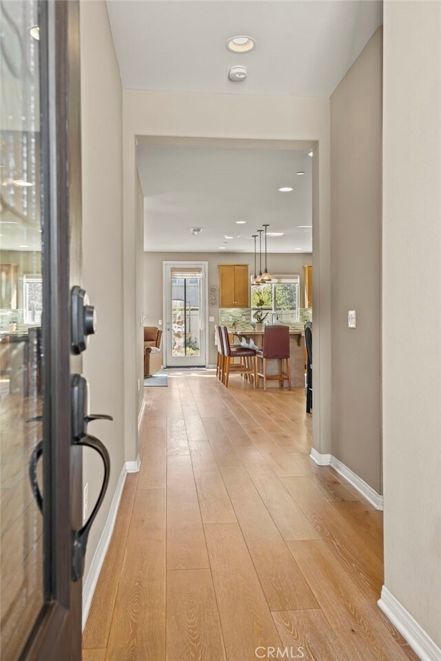 hall with light wood-type flooring