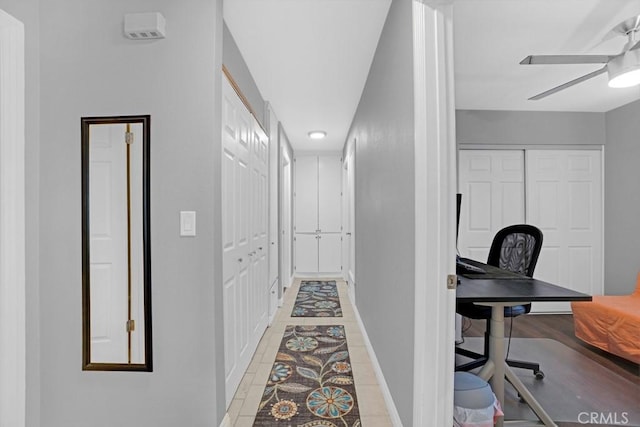 corridor with light tile patterned floors