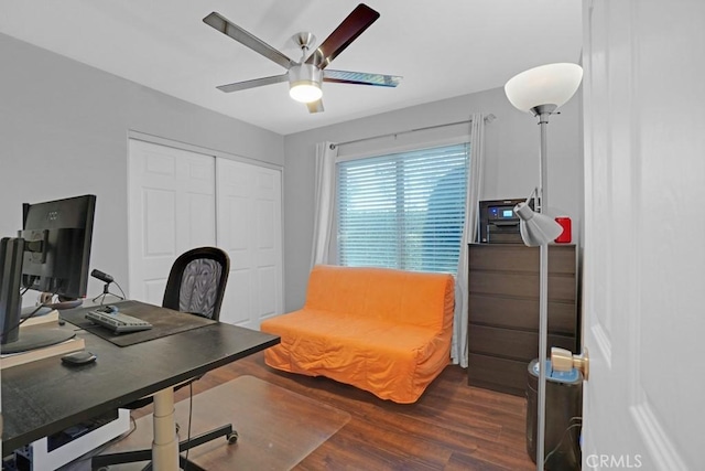 home office featuring ceiling fan and dark wood-type flooring