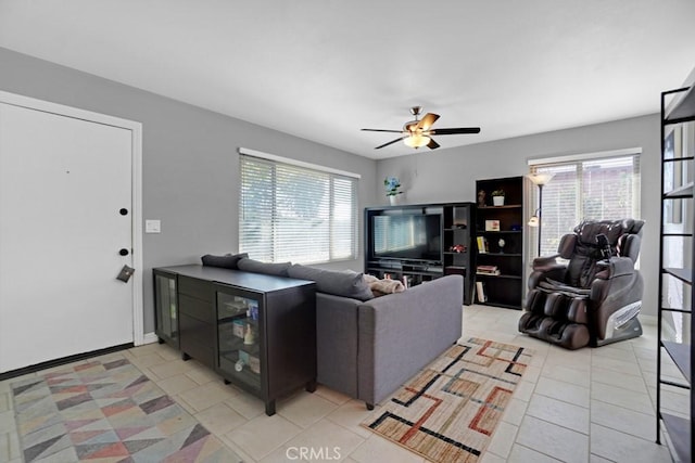 tiled living room featuring ceiling fan