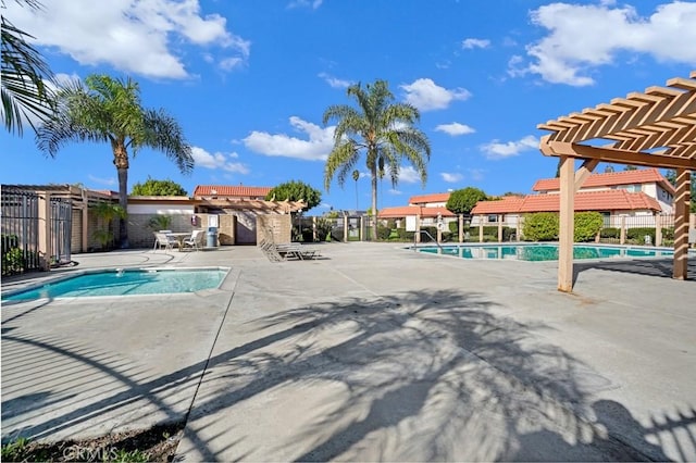 view of pool with a pergola and a patio area