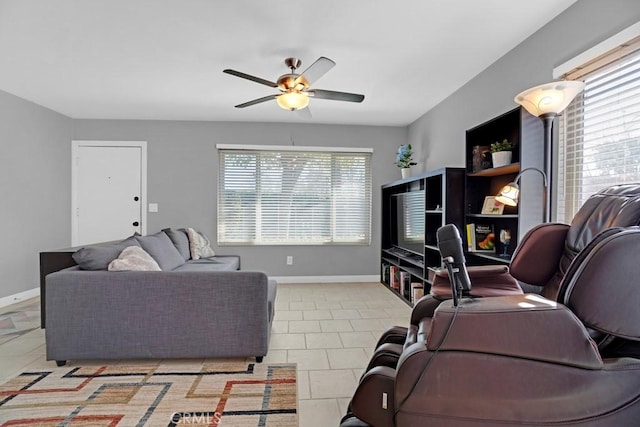 tiled living room featuring ceiling fan