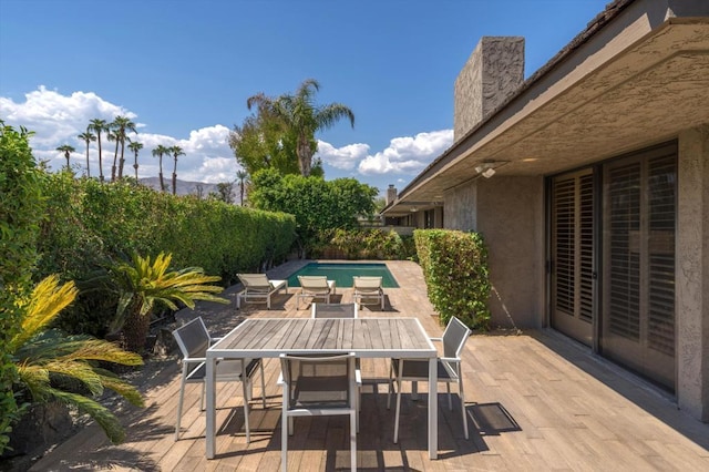 view of patio / terrace featuring a fenced in pool