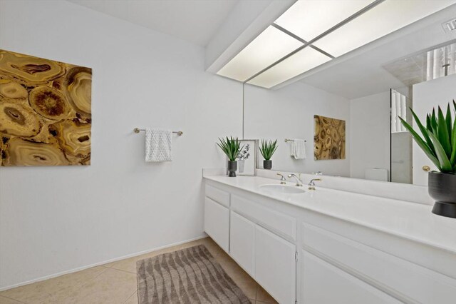 bathroom featuring tile patterned floors and vanity