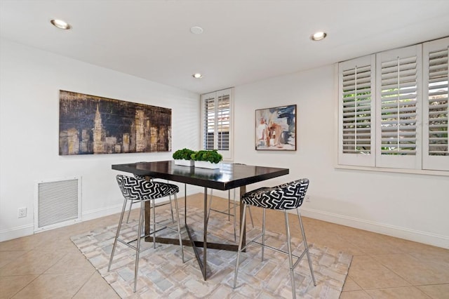 dining room with light tile patterned flooring