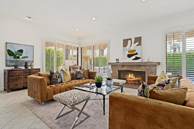 living room featuring light tile patterned floors, a high end fireplace, and crown molding