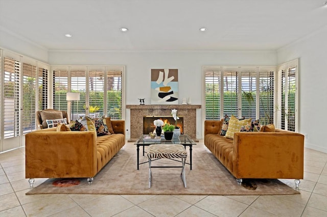 tiled living room with ornamental molding and a fireplace