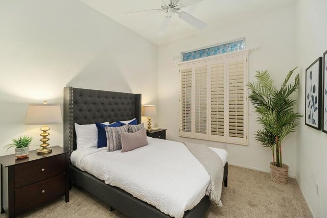 bedroom featuring ceiling fan and light carpet