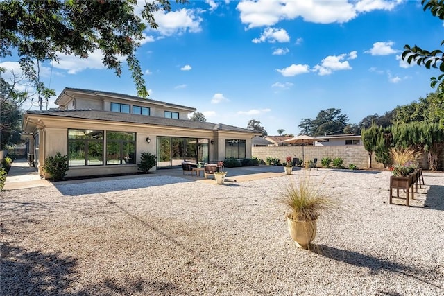 back of house featuring a patio area