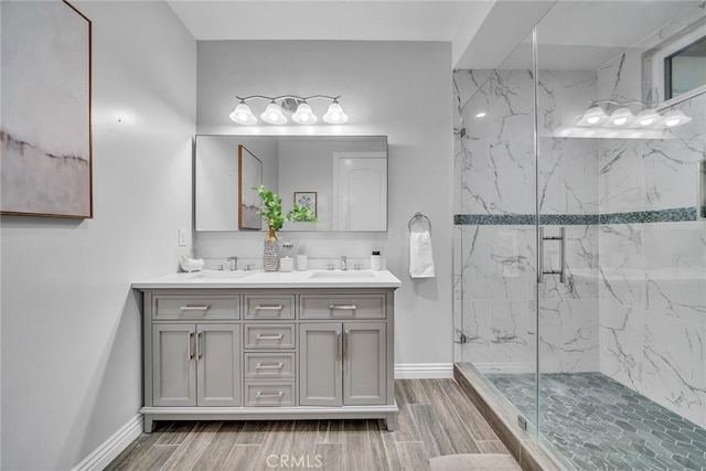 bathroom with an enclosed shower and vanity