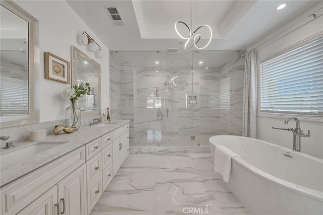 bathroom with crown molding, vanity, independent shower and bath, and a tray ceiling