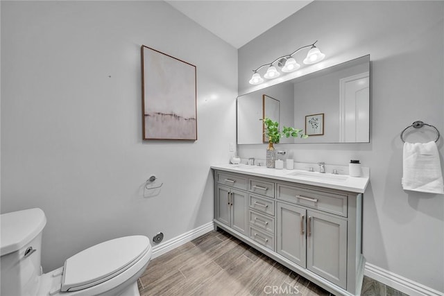 bathroom featuring toilet and vanity