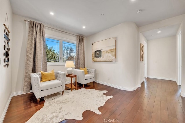 sitting room featuring dark hardwood / wood-style flooring