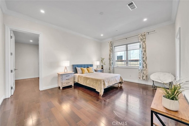 bedroom featuring dark wood-type flooring and ornamental molding