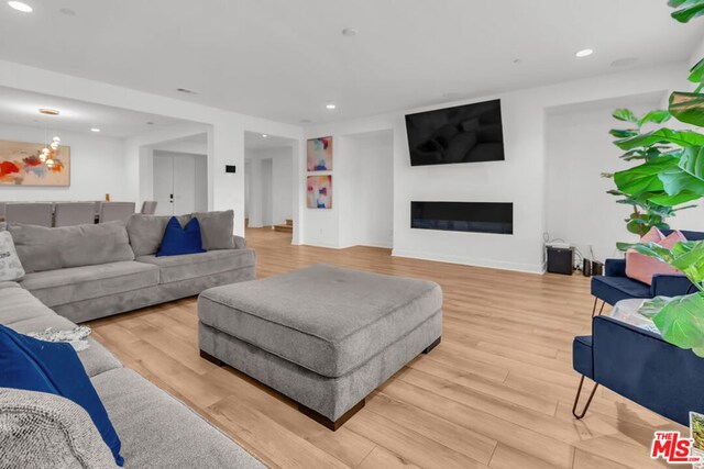 living room with light hardwood / wood-style floors