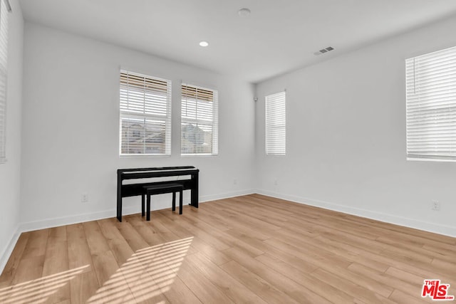 empty room with light hardwood / wood-style floors