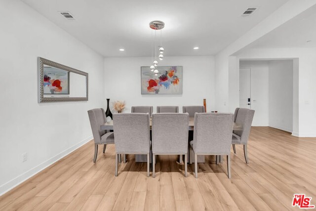 dining area with light hardwood / wood-style floors