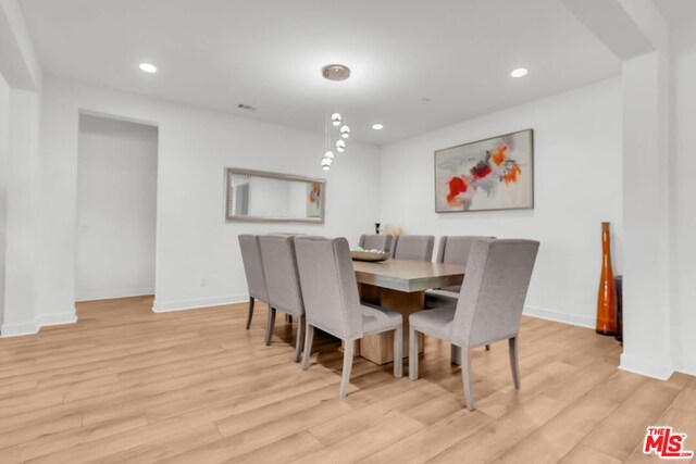 dining space featuring light hardwood / wood-style floors