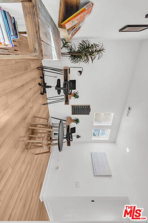 interior space featuring ceiling fan and wood-type flooring