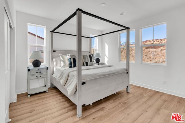 bedroom featuring light hardwood / wood-style flooring