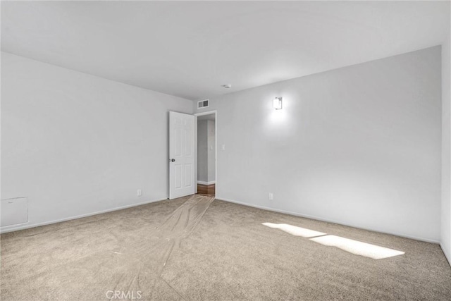 empty room featuring carpet flooring