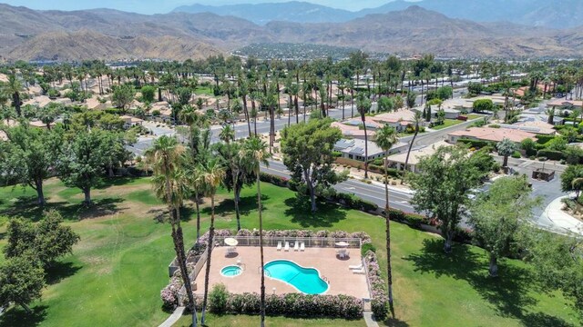 birds eye view of property with a mountain view