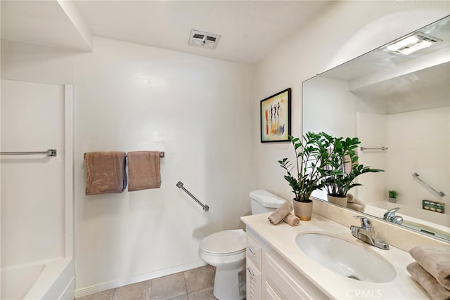 bathroom with vanity, tile patterned floors, and toilet