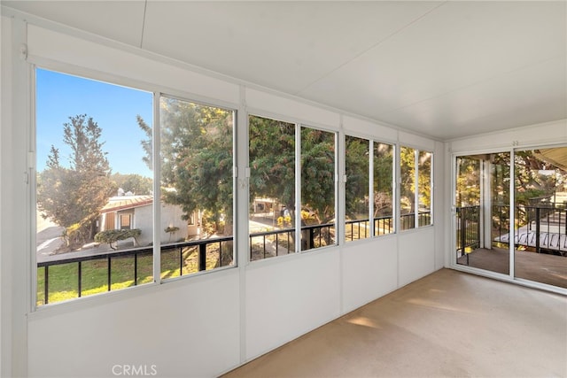 unfurnished sunroom featuring a wealth of natural light