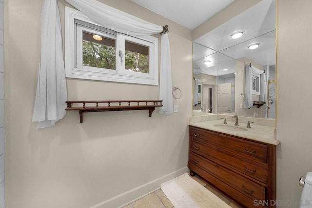 bathroom with tile patterned floors and vanity