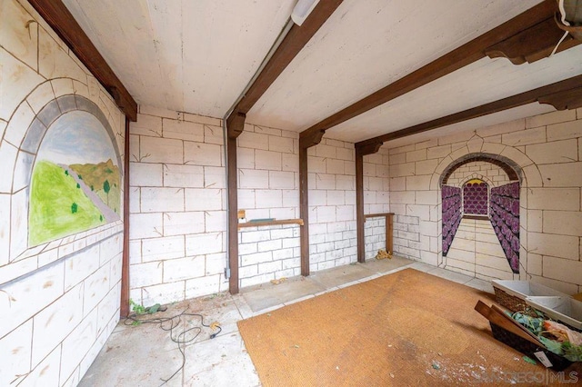 miscellaneous room featuring beamed ceiling