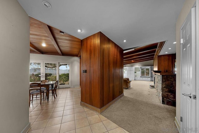 kitchen with wooden ceiling, light colored carpet, french doors, and lofted ceiling with beams