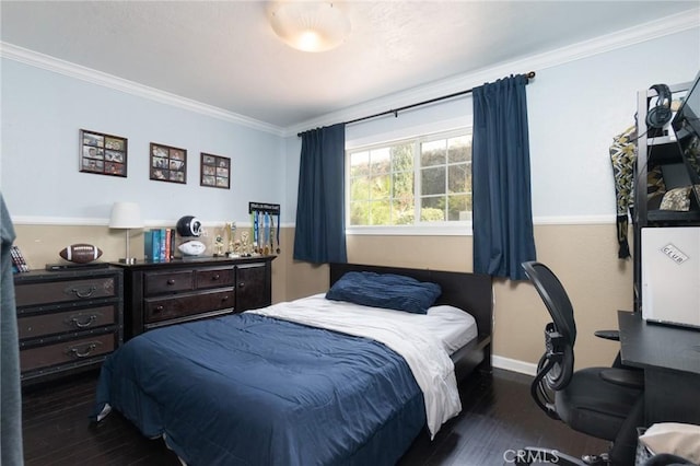 bedroom with dark hardwood / wood-style floors and crown molding