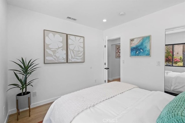 bedroom featuring hardwood / wood-style flooring