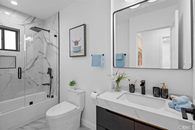 full bathroom featuring enclosed tub / shower combo, toilet, and vanity